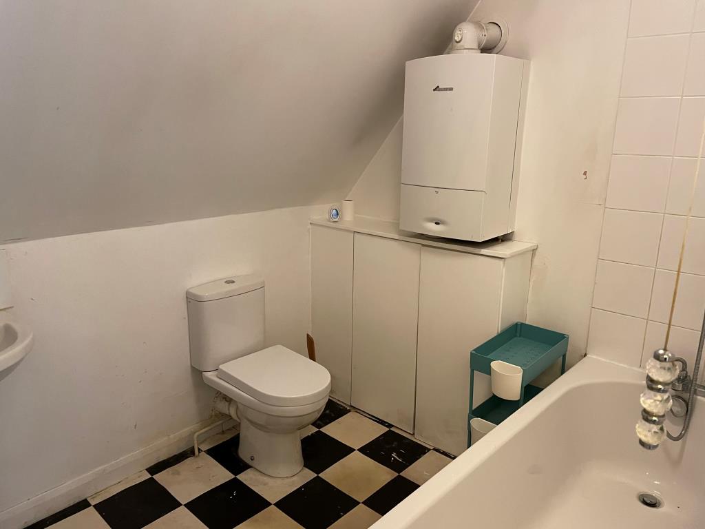 Lot: 4 - TWO-BEDROOM FLAT IN NEED OF RE-DECORATION - Bathroom with W.C.